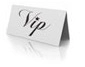 Macro shot of minimalist white VIP table tent card with elegant black calligraphy text