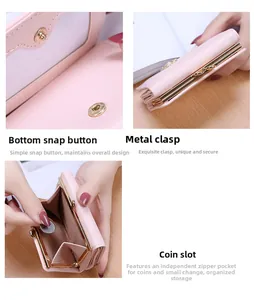 Detail view of pink trifold wallet with gold snap button and metal coin pocket
