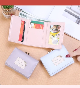 Inside view of women's tri-fold wallet showing multi-card slots and photo holder