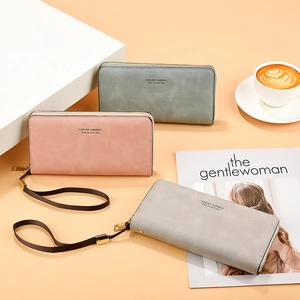 Long faux suede zipper wallet for women in green, pink and grey colors with wrist strap