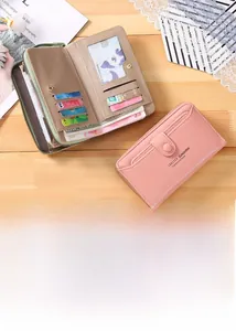 Detail showing pink and taupe long wallets with multiple card slots and leather texture