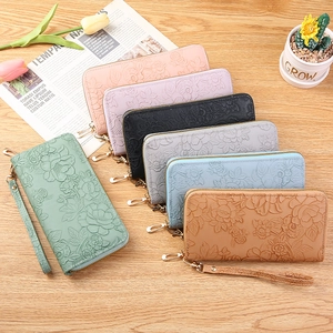 Women's long floral embossed leather zip wallets with detachable wristlets in multiple colors
