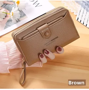 Brown long leather wristlet wallet featuring embossed lettering and荔枝 texture finish