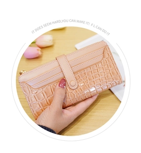 Detail of pink stone-patterned wallet featuring multiple card slots and metal zipper