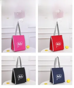 Collage of insulated lunch bags in pink, red, black, and blue with Hello print