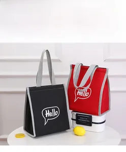 Black and red portable lunch bags with Hello print and grey nylon handles on a white table
