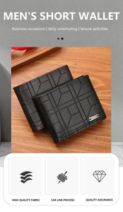 Detail of men's short wallet with geometric embossed texture and metal accent on desk