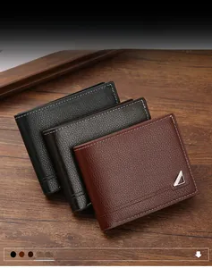 Detail view of men's bifold wallets in litchi grain leather with stitching and metal logo