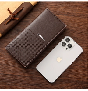 Detail of coffee brown long wallet showing woven texture and smooth faux leather material