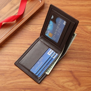 Men's dark brown textured leather bifold wallet with card slots on a wooden background