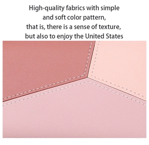 Detail of pink patchwork leather wallet with lychee grain texture and neat white stitching