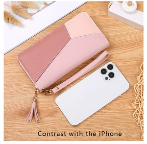 Detailed view of women long tricolor leather wallet with tassel and wristlet strap
