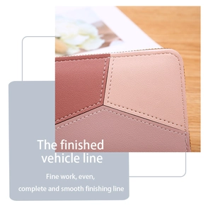 Close-up of precise stitching and lychee grain texture on pink patchwork leather wallet