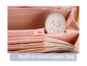 Macro view of the internal zipper pocket in pink wallet showing storage for coins