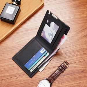 Classic black leather bifold wallet for men with multi-card slots on a wooden desk