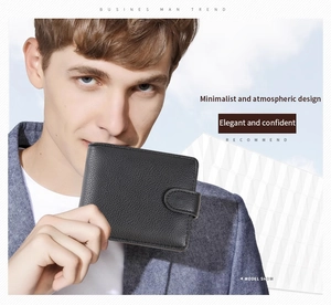 Litchi pattern black leather wallet for men held by model in professional setting