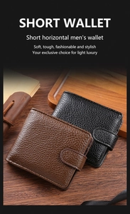Detail of short leather men's wallets in black and brown with lychee grain texture