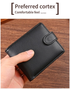 Close-up of black lychee grain PU leather wallet with snap closure and neat stitching