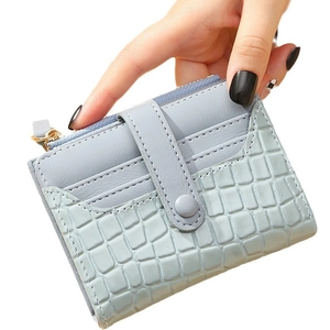 Light blue faux crocodile skin short wallet with card slots and a zipper pocket
