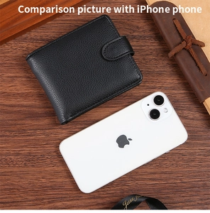 Men's bifold wallet in black lychee grain leather compared to an iPhone for size scale