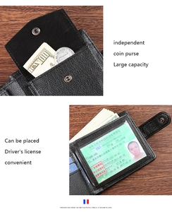 Detail view of men's leather wallet with coin pocket and ID window on wood background