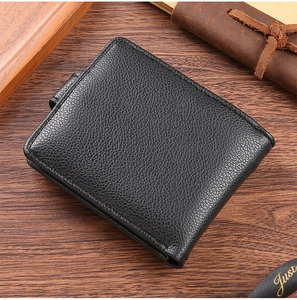 Close-up of black bifold men's wallet featuring high-quality lychee grain PU leather