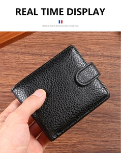 Detailed view of the black textured leather men's wallet with secure snap closure