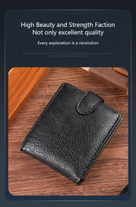 Detailed view of black men's wallet with lychee texture and leather buckle closure