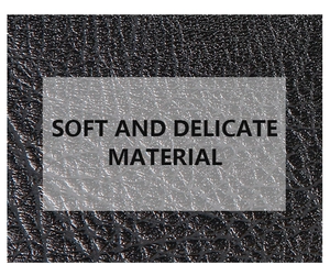 Macro shot of soft black litchi grain leather texture with a delicate polished finish