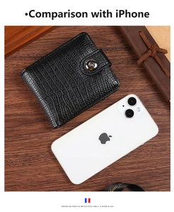 Men's black crocodile pattern PU leather wallet shown next to a smartphone for size scale