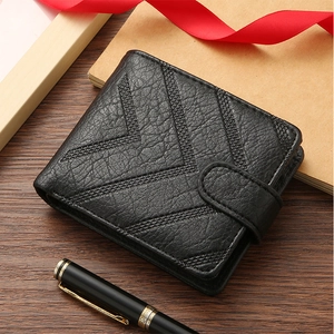 Detailed close-up of a black lychee texture leather wallet with geometric embossing