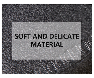 Detail of black PU leather wallet showing soft litchi texture and embossed lettering
