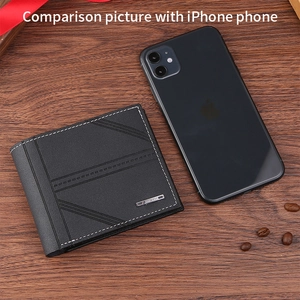 Short men's wallet size comparison with iPhone on brown wood background