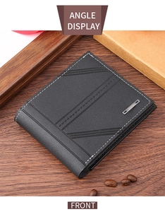 Detailed view of black leather wallet with diagonal embossing and contrast stitching