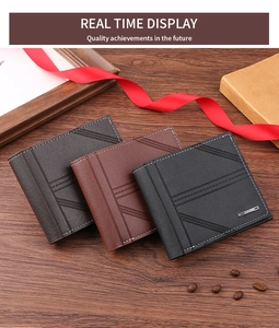 Detail of short leather wallets in three colors with litchi texture and contrast stitching