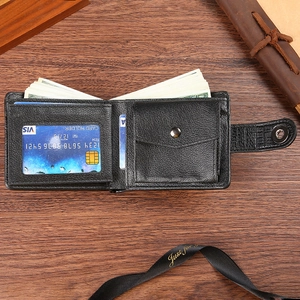 Classic black men's PU leather bifold wallet with coin pocket on a wooden surface