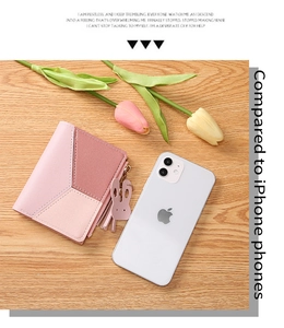Detailed close-up of pink patchwork PU leather wallet with rabbit charm and tassel