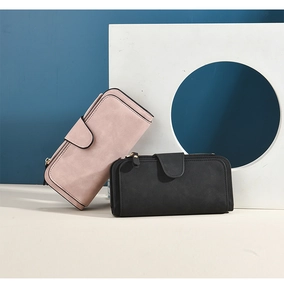 Close-up of matte long wallets in pink and black with stylish buckle and zipper details