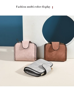 Three suede leather wallets in pink, brown, and gray with snap button and zipper closure