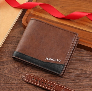 Close-up of brown men's wallet with black leather patch and elegant textured finish