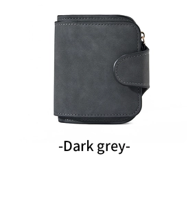 Detail of dark grey short wallet featuring matte texture and fine topstitching accents