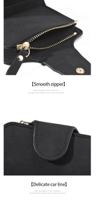Detail of the smooth golden metal zipper and neat stitching on the black leather wallet