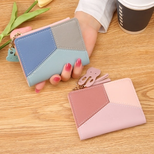 Women's bifold short wallet with geometric patchwork design and tassel charm decoration