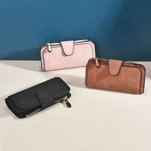 Three elegant matte leather wallets for women in pink brown and black with buckle