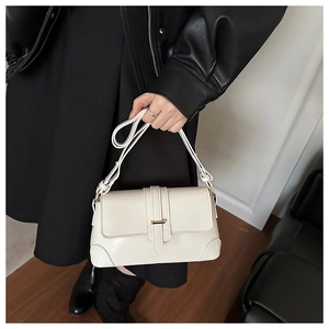 Detail of off-white rectangle shoulder bag with gold metal buckle and reinforced stitching