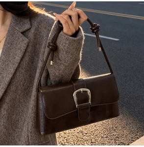 French vintage baguette bag in dark brown glossy oil leather with a horseshoe buckle