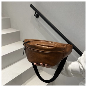 Brown vintage PU leather chest bag with adjustable strap and dual zipper pockets