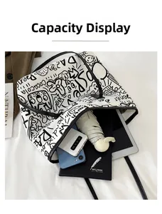 Macro detail of graffiti tote bag showing large capacity for umbrella and tablet