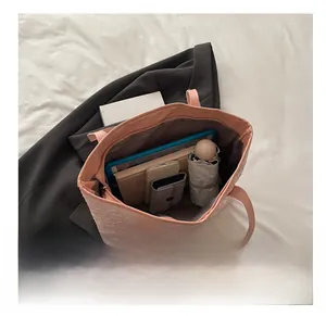 Top view of pink quilted tote bag showing large capacity for tablet and daily items