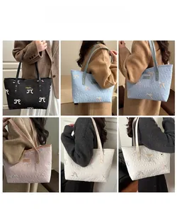 Quilted tote bag with embroidered bows shown in four colors for commuting